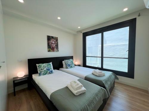 En eller flere senger på et rom på Faro Design 1 by Homing