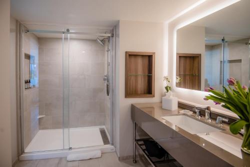 a bathroom with a shower and a sink at Hotel Madera in Washington
