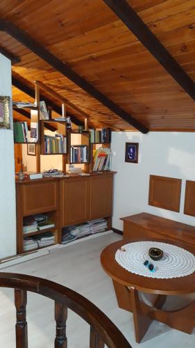 a living room with a table and a chair at Iriški san in Irig