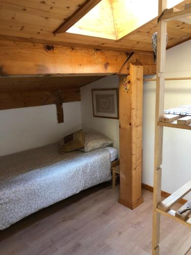 a bedroom with two bunk beds in a cabin at Central Hostel Chatel in Châtel