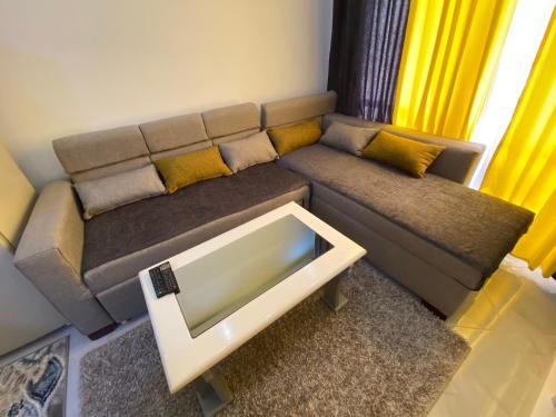 a living room with a couch and a coffee table at أجمل شاليه فى بورتو مطروح للعائلات فقط in Marsa Matruh