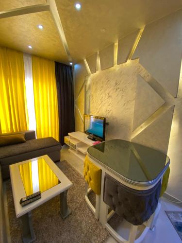 a living room with a couch and a table at أجمل شاليه فى بورتو مطروح للعائلات فقط in Marsa Matruh