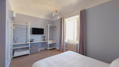 Postel nebo postele na pokoji v ubytování D-Home Ortigia