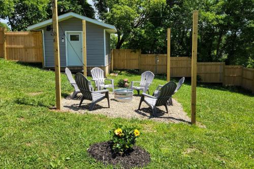 a group of chairs sitting in a yard at Pet-Friendly Digs with Fire Pit and Large Yard! in Fayetteville
