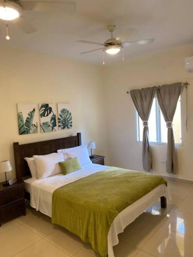 a bedroom with a bed and a ceiling fan at Lovely 2 Bedroom Apartment in Quiet Neighborhood! in Philipsburg