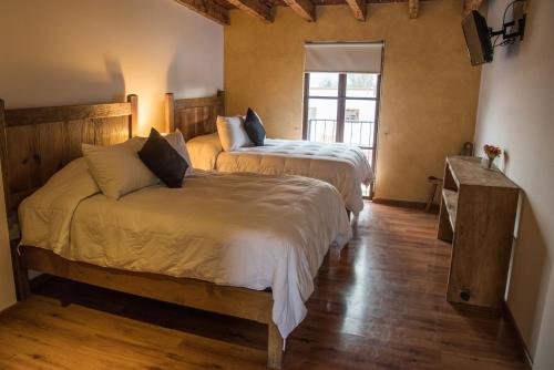 מיטה או מיטות בחדר ב-Rancho La Mesa