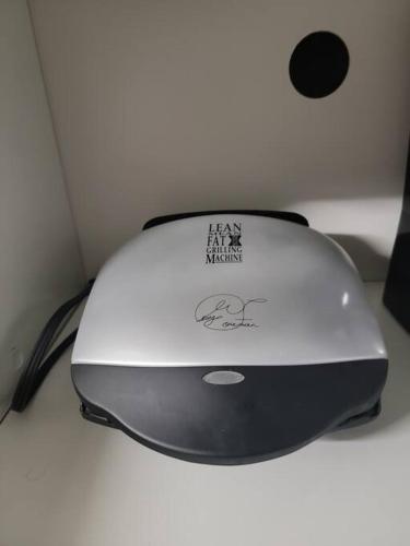 a computer mouse sitting on top of a desk at Staycation Studio Apartment, Private kitchen , Washroom, Micro Gym & Free Onsite Parking in London