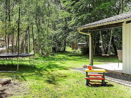 a yard with a swing and a playground at 6 person holiday home in Vig in Vig