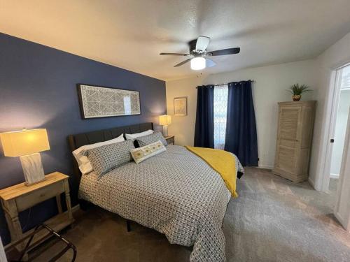 a bedroom with a bed and a ceiling fan at Sunrise Experience w/King Size Bed & Pet Friendly in Roswell