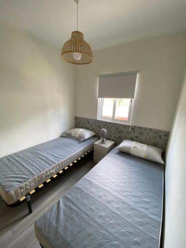 Katil atau katil-katil dalam bilik di Casa dos Sobreiros