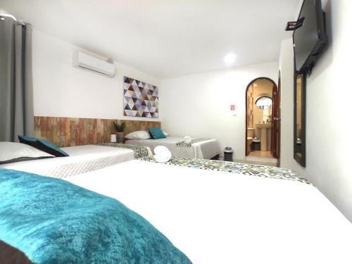 Cama o camas de una habitación en Walena Hotel
