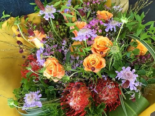 a bouquet of colorful flowers in at Kappo Ryokan Yumesaki in Beppu