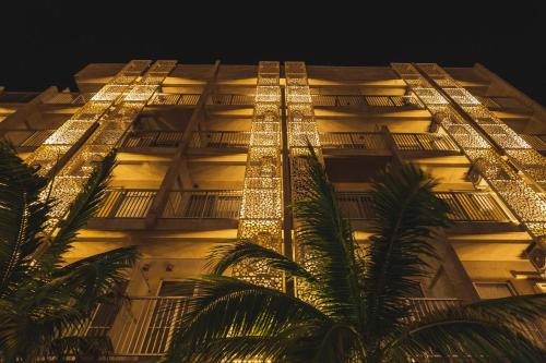 a building with christmas lights on it at night at The BREAKFAST HOTEL PORTO Ishigakijima in Ishigaki Island