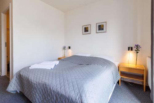 En eller flere senge i et værelse på Hotel Rudkøbing Skudehavn
