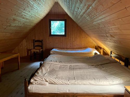Postelja oz. postelje v sobi nastanitve Architect`s Cottage - serenity and greenery in the highlands