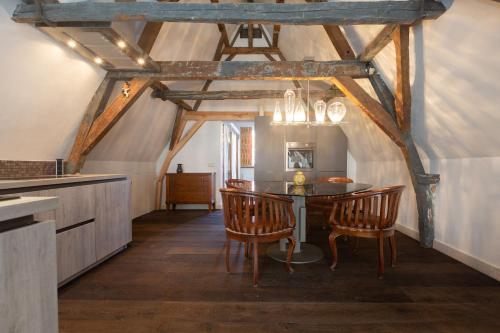 a dining room with a table and chairs at The Loft 300 - R Q C in The Hague