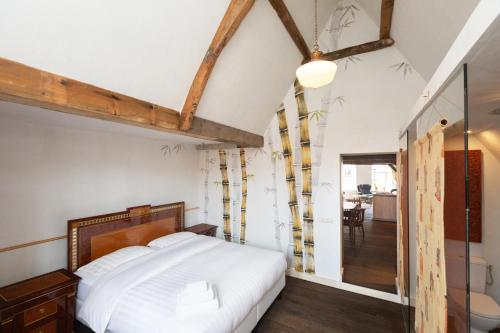 Ένα ή περισσότερα κρεβάτια σε δωμάτιο στο The Loft 300 - R Q C