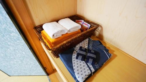 Giường trong phòng chung tại 素泊り旅館 Yururi