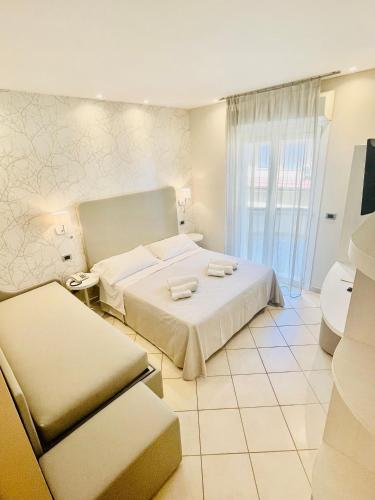 Letto o letti in una camera di Melody Hotel