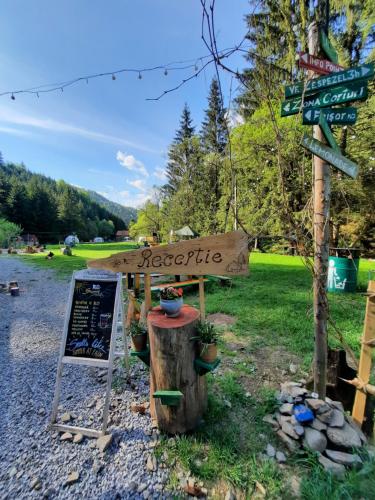a sign that says cooperative next to a street at Fain in Lunca Bradului