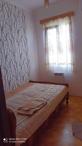 Ένα ή περισσότερα κρεβάτια σε δωμάτιο στο Hotel Kharabadze