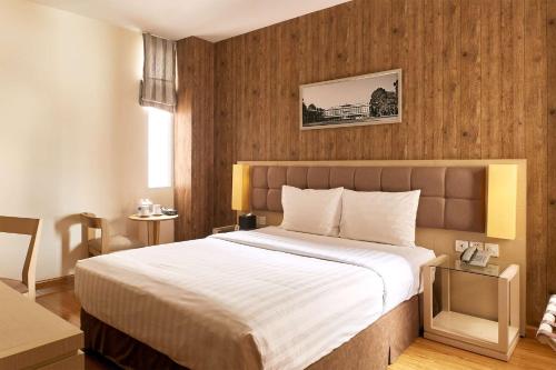 a bedroom with a large bed in a room at GK Central Hotel in Ho Chi Minh City