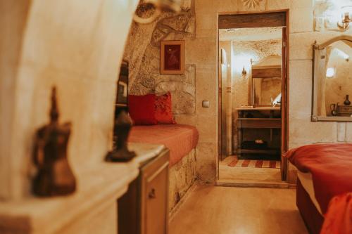 מיטה או מיטות בחדר ב-Elaa Cave Hotel