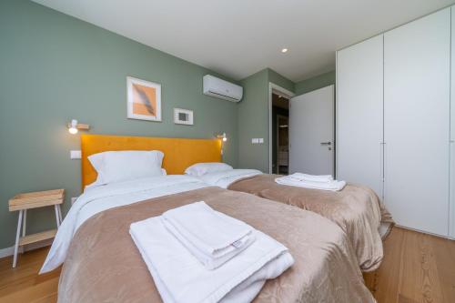 Ένα ή περισσότερα κρεβάτια σε δωμάτιο στο Trindade Duplex by Amber Star Rent