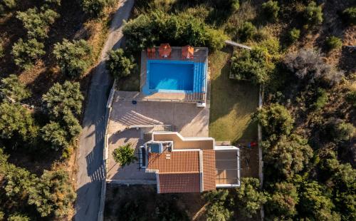 an aerial view of a house with a swimming pool at Villas Almyrida in Almirida