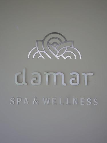 a logo for a spa and wellness center at Sima Hotel Kuta Lombok in Kuta Lombok