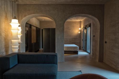 a living room with a couch and a bed at I Vivai in Montemurlo