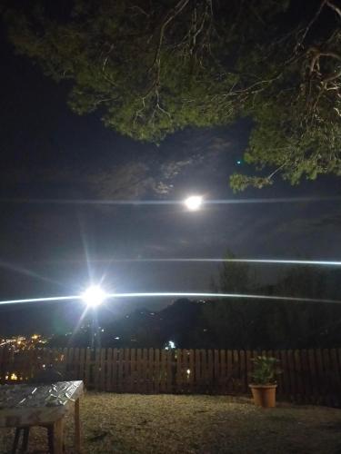 a night view of a fence with two lights at Agriturismo Soleada in Ventimiglia