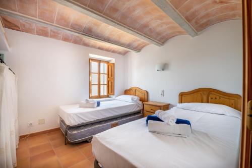 Posteľ alebo postele v izbe v ubytovaní Casa Can Pauma