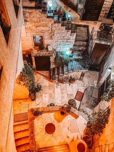 an overhead view of a room with tables and plants at Elaa Cave Hotel in Ortahisar