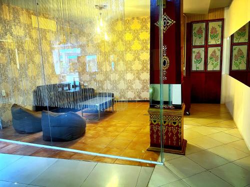 a room with a table and a glass wall at Silver Resortel in Patong Beach