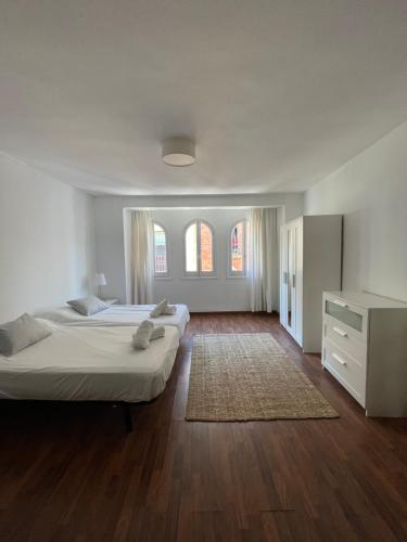 Posteľ alebo postele v izbe v ubytovaní IRUA APARTAMENTOS