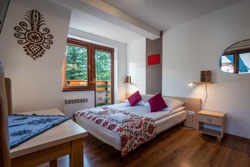Posteľ alebo postele v izbe v ubytovaní Aparteo Apartamenty Strzelców Podhalańskich 34