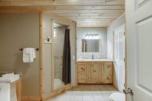 a bathroom with a shower and a sink at Listen to Chattahoochee RiverSleeps 8Near Helen in Sautee Nacoochee