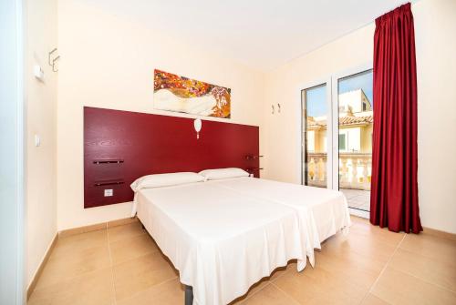 Ένα ή περισσότερα κρεβάτια σε δωμάτιο στο Residence El Paraiso Sa Rapita