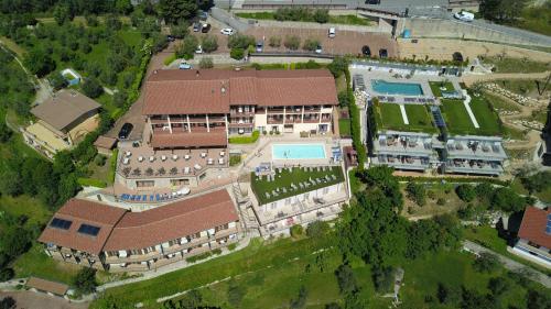 an overhead view of a large building with a pool at Residence Ruculì - Ruculì Hospitality in Tignale