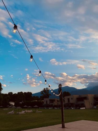 a statue of a person holding onto a string of lights at Dion Palace Resort and Spa in Limani Litochorou