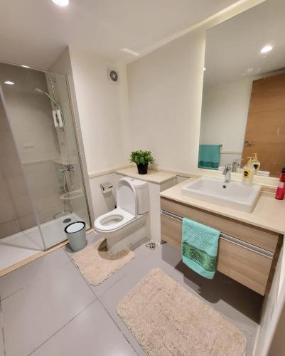 a bathroom with a toilet and a sink and a shower at Marassi Marina 2 - Salt Lake Chalet in El Alamein