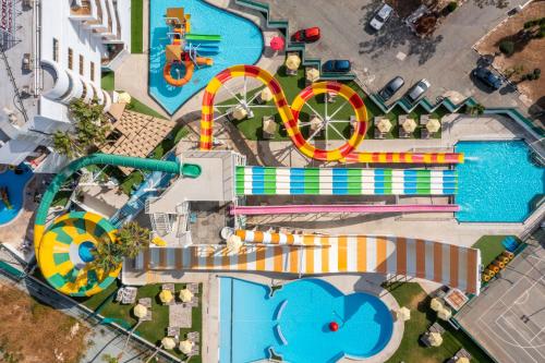 an overhead view of a water park with a roller coaster at Leonardo Laura Beach & Splash Resort in Paphos