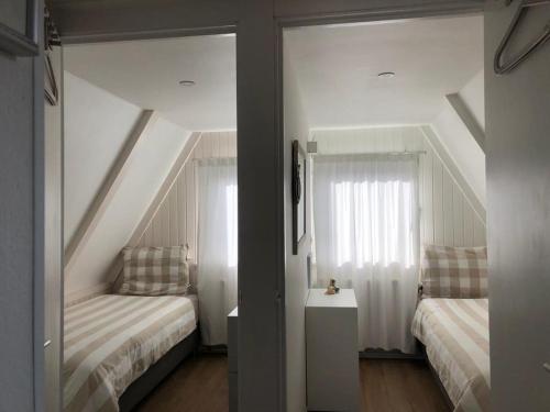 Säng eller sängar i ett rum på Vakantiehuis uus Klinte Hindeloopen