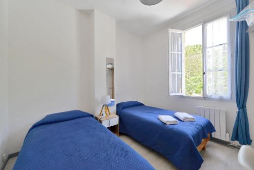 Ένα ή περισσότερα κρεβάτια σε δωμάτιο στο COMME A LA MAISON