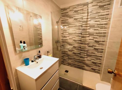 a bathroom with a sink and a shower at Novelty I in Salou