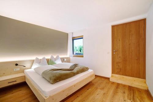 Ένα ή περισσότερα κρεβάτια σε δωμάτιο στο Waalhof Ferienwohnung Golden