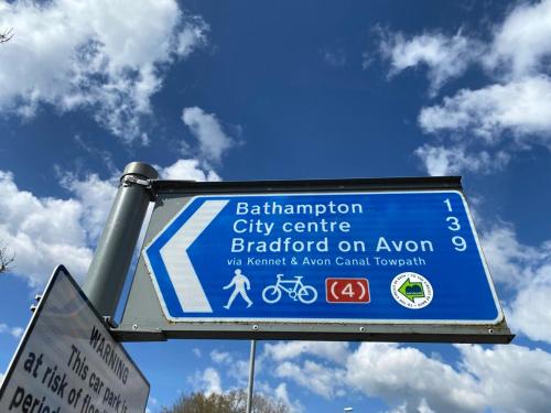 a blue sign for a city centre bradford on avon at Burgess Yard 2-bedroom cottage, Bath in Bath