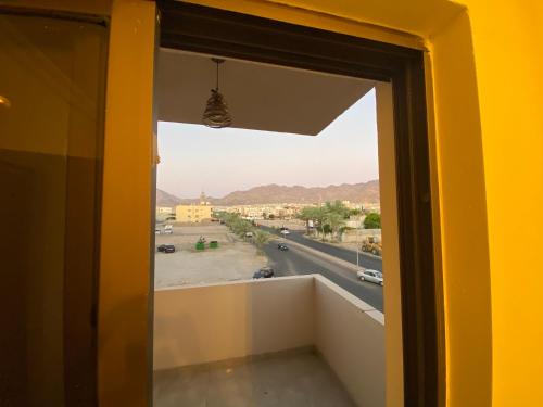 a room with a window with a view of a street at Lovely 3-bedrooms rental unit in Aqaba