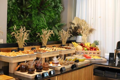 a buffet with many different types of food on display at Best Western Premier Ark Hotel in Tirana